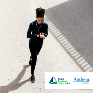 woman running and using a fitness tracker